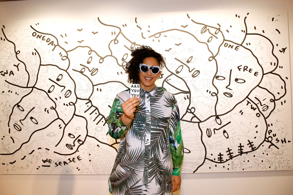PARIS, FRANCE - MARCH 02:  Artist Shantell Martin poses in front of her work during the Max Mara 'Prism in Motion' Eventas, with the presentation of the new collection Capsule of sunglasses Max Mara, realized in collaboration with the American artist Shantell Martin. As part of Paris Fashion Week Womenswear Fall/Winter 2017/2018 at  on March 2, 2017 in Paris, France.  (Photo by Bertrand Rindoff Petroff/Getty Images for Max Mara) *** Local Caption *** Shantell Martin