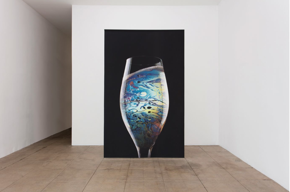 “Glass of Petrol” 2015, Printed textile 118 x 73 1/2 in / 300 x 187 cm Courtesy of the artist and Overduin & Co., Los Angeles Photo credit: Brian Forrest