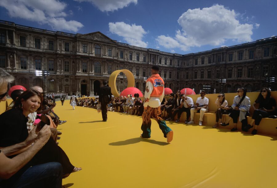 Louis Vuitton inserts a yellow racetrack at the Louvre for Spring